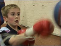 Boy working at a punch ball