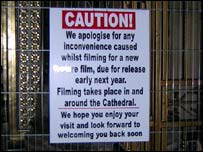 A sign informing visitors about the filming.