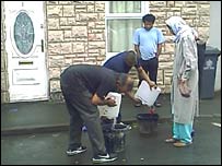 Muslim volunteers deliver water in Barton