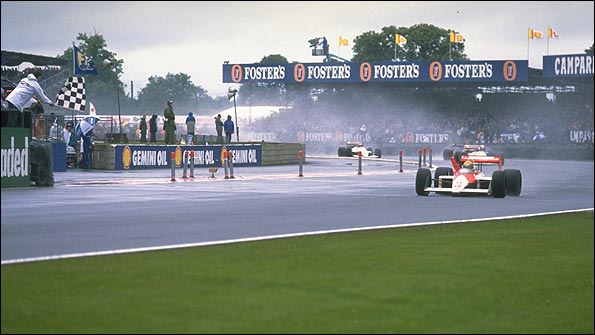 Ayrton Senna takes the chequered flag for McLaren at the 1988 British Grand Prix