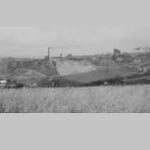 View from Rosehill, Moresby looking downhill towards the coast. It shows Harrington No 10 & No 11 Collieries at Lowca, Micklam Tar & Brickworks, Moresby Church in the mid-distance & Moresby Vicarage roof at the bottom left.