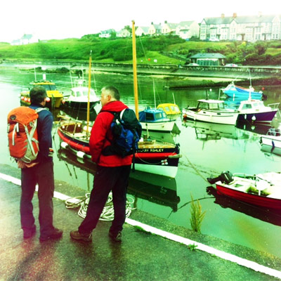 Producer Gareth Rees-Rowlands and Derek looking at the restored lifeboat in the harbour.