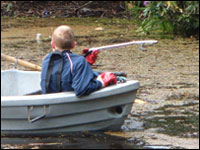 Young person in boat on the pond