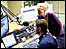 Presenter Matt Woodley and producer Jess Dunbar working in the studio