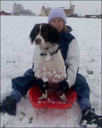 Joanne sledging with her dog