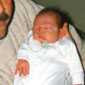 Nigel with his son in the Royal Victoria hospital, 2 weeks old