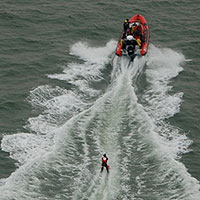 Christine water-skiing to France