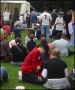 People sitting round at Leamington Peace Festival 