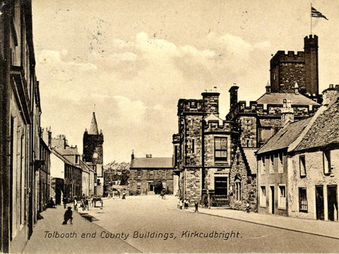 Black and white view along High Street, Kirkcudbright, showing the Tolbooth and the County Building