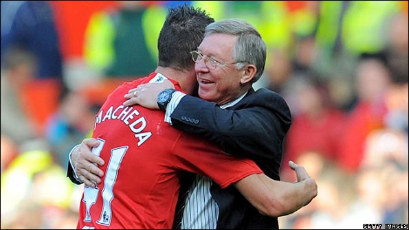 Man Utd's Federico Macheda hugs his manager Sir Alex Ferguson