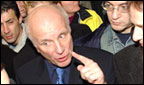 Greg Dyke, surrounding by supporting staff