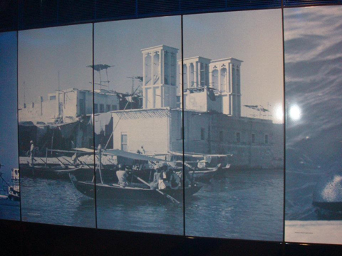 Picture showing the wind towers and boats of old Dubai