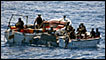 Boarding teams from the German warship Bremen stop two suspected Somali pirate skiffs in the Indian Ocean, 450 nautical miles east of Mogadishu, 20 October 2009