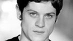 Black and white image of Iwan Rheon