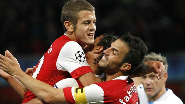 Marouane Chamakh celebrates scoring his goal with Jack Wilshere and Cesc Fabregas
