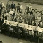 I am the little girl in the centre of the picture on the back row in my dad's arms.