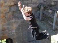 Member of North East Parkour doing an arm jump