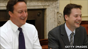 David Cameron and Nick Clegg sitting in the Cabinet room