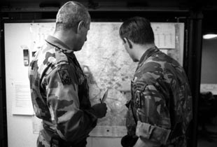 Soldiers looking at a map.