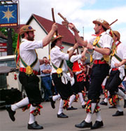 Morris dancers in traditional costumes, hats and shoes