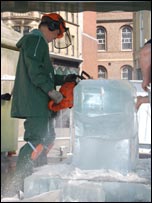 Dave Gross sculpting ice with a chainsaw