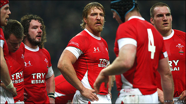 Wales players look downcast after defeat to France in Paris last year.jpg