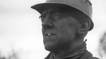 Black and white photograph of miner Llew Jones from Cwmgiedd who featured in Silent village.
