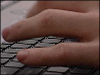 Hand on computer keyboard 