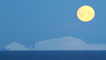 Moon sets over snowy isle of Foula