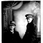 George Lord, at the age of 33,stood and friend seated taken December 21, 1944 at Swift Studio, 13 Sidwell Street, Exeter, England