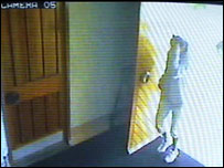 CCTV footage of a girl coming through a door