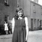 Anne's Aunt Margaret, 12 years old in Mc Naneys Court, mentioned in the story. The Children in the background are called Molly, Nora and Bernadette Gormley