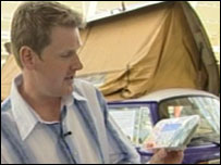 Dave Harvey holding packet of veg