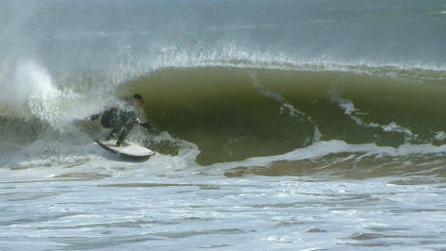 A surfer getting barrelled at Broadhaven