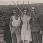 Percy Holmes (in Civvies) on 72-Hour Leave, Olive Holmes, Frank Huxley (Brother-in-Law), just arrived on 72-Hour Leave.Back garden, Wordsworth Rd - Air Raid shelter on left.