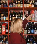 Karen grabs a bottle 