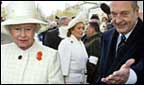 President Chirac showing the Queen where to go.