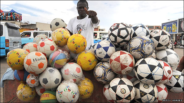 Street vendor sells footballs during Africa Cup of Nations 