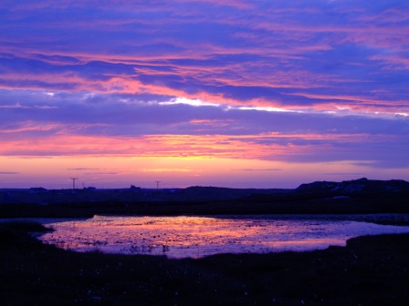 Splendour of sunset over lily filled loch in North Locheyenort, South Uist