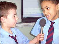 Children interviewing each other.