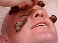 Mike Dilger with snails on his face