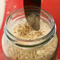 Knife above rice in a jar