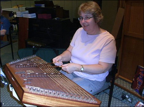 Playing the dulcimer