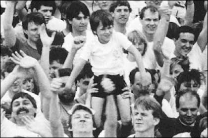 Boy held aloft at the start of the Run The World event.