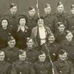 This photograph was taken after the disbanding parade of our Company. Three ladies are with them. I am the one in the middle of the three.