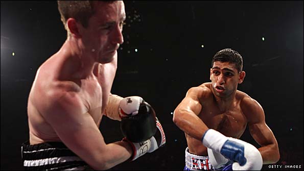 Khan (right) beat McCloskey on points