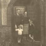 My father and mother, with me and my brother, John, at the ever-open door