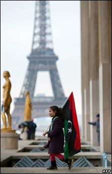An anti-Gaddafi demonstrator on the Trocadero Square near the Eiffel Tower in Paris (19 March 2011)