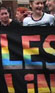 Image of woman carrying Lesbian banner