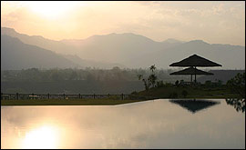 Sunset across the swimming pool
